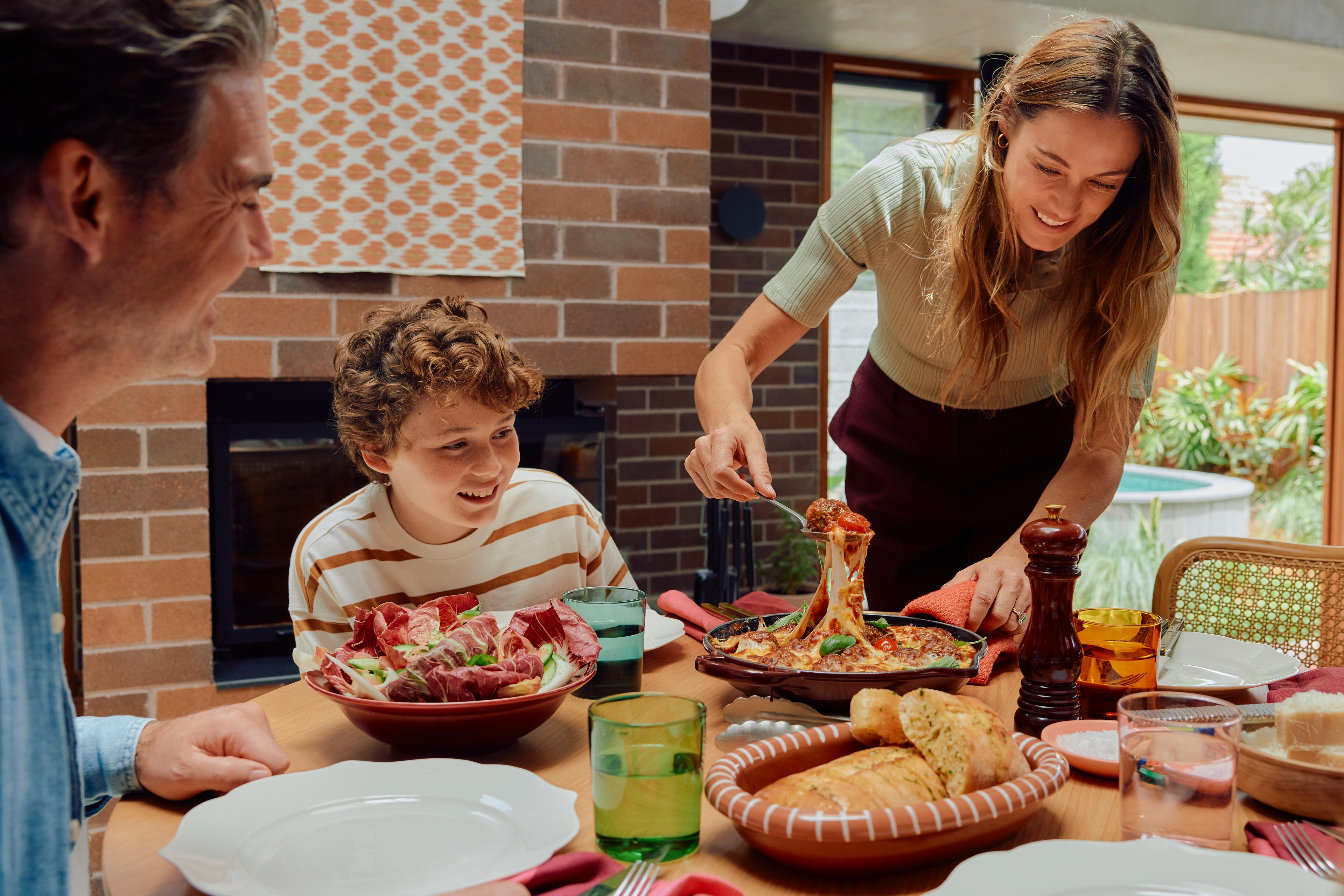 Family serving QuiteLike recipe at dinner table